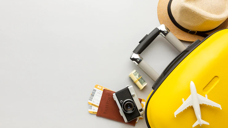 flat-lay-yellow-luggage-with-copy-space_23-2148786124